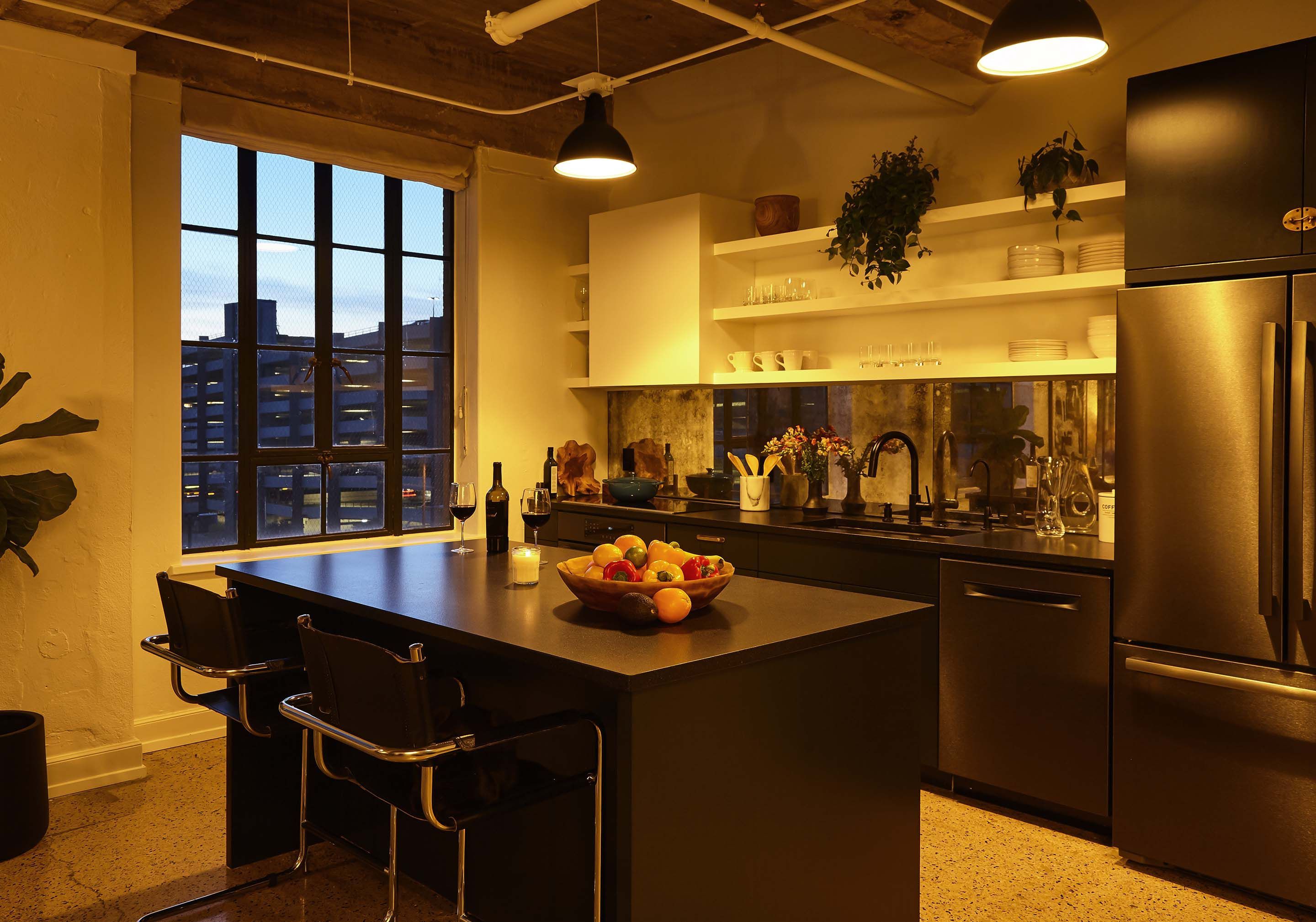 Control4 Touch panel in a able with a traditional home in the background